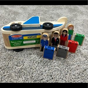 Melissa and Doug wooden airplane toy with 4 figurines and 4 suitcases.